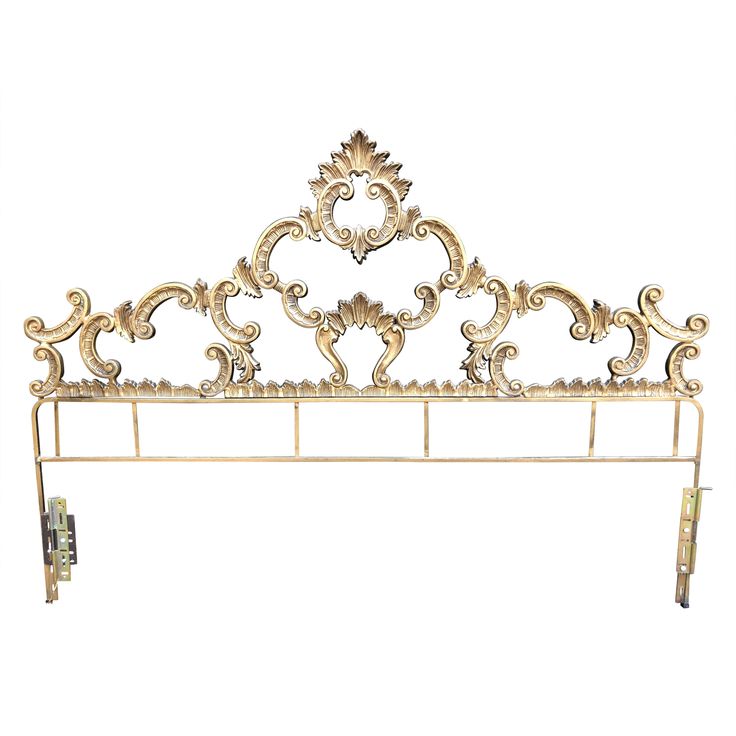 an ornate gold headboard is shown against a white background