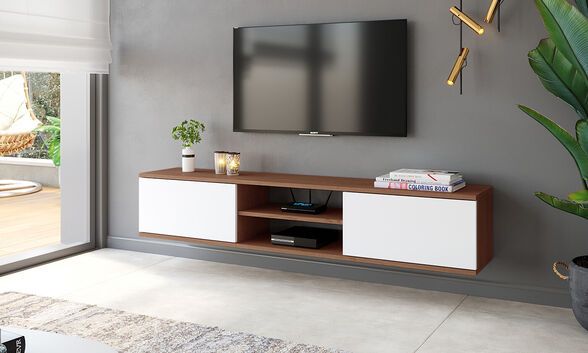 a flat screen tv sitting on top of a wooden entertainment center next to a potted plant