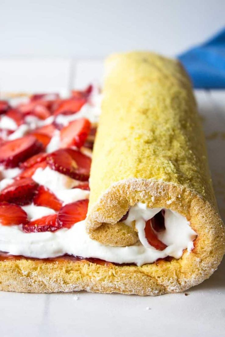 a pastry with strawberries and cream on it