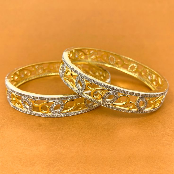 Unique and Stunning, White American Diamond stone bangles. These bangles are in gold-tone and will match a variety of outfits. You can wear them with formal traditional outfits, western outfits, or even informal casual gatherings. Best for gifting or for personal use, wear it to any occasion and be the spotlight. Eye-catching and unique jewelry that will set you apart. Gift this piece to a loved one, and see their face light up with joy.