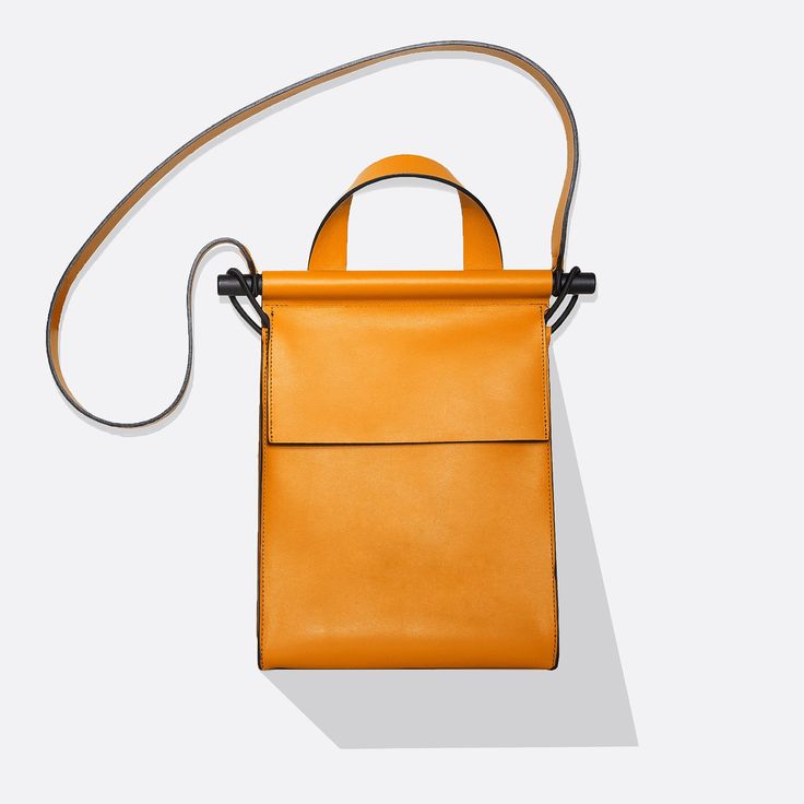 sunshine#color_sunshine Rectangular Leather Flap Bag For Shopping, Everyday Flap Bag With Top Leather Handle, Everyday Flap Bag With Top Handle And Leather Handles, Leather Box Bag With Detachable Handle For Everyday Use, Modern Satchel Flap Bag With Leather Handles, Modern Crossbody Box Bag With Leather Handles, Modern Saddle Bag Tote With Detachable Handle, Modern Leather Flap Bag For On-the-go, Modern Pouch Flap Bag With Top Carry Handle