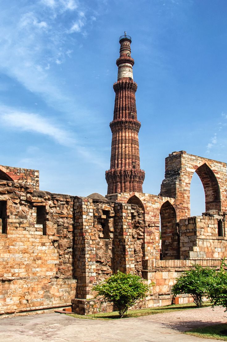 an old brick building with a tall tower in the middle of it's courtyard