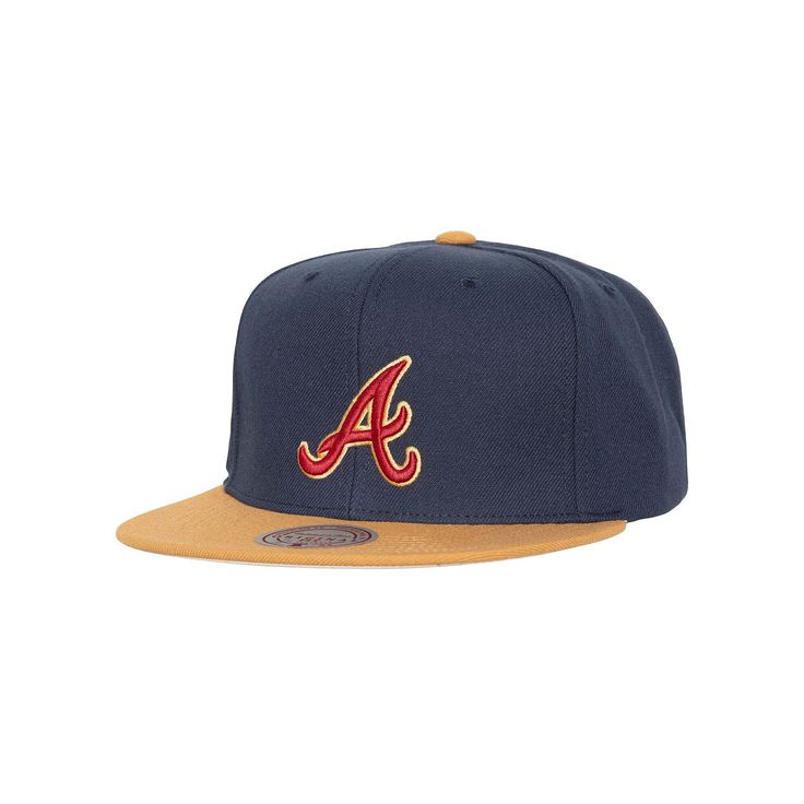 the atlanta braves'new era fitted hat is shown in navy and gold, with an embroidered logo on the front