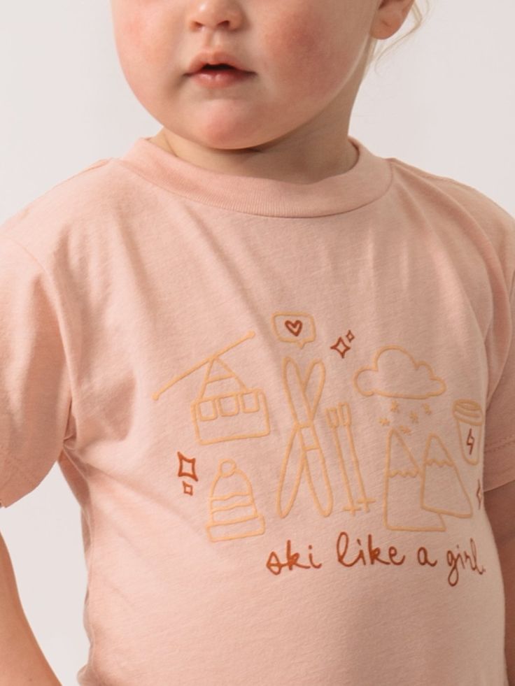 Ski Like a Girl™ Gear up your little adventurer with this soft, relaxed-fit whimsical toddler tee with the iconic ski like a girl™ icon. It features a playful illustration of ski essentials like boots, poles, and more. Perfect for pint-sized powder hounds dreaming of their next snowy adventure! Measurement 2T 3T 4T 5T Fits Body Weight (lbs) 30-33 33-36 36-40 40-45 Fits Body Length 32-35" 35-38" 38-40" 40-43" Please note measurements may vary by 1". Weights are approximate. Fits: True to size. Ru Ski Essentials, Playful Illustration, Holiday Puzzle, Seasonal Candles, Ski Girl, Curated Gift Boxes, Entertainment Bar, Holiday Candles, Girl Toddler