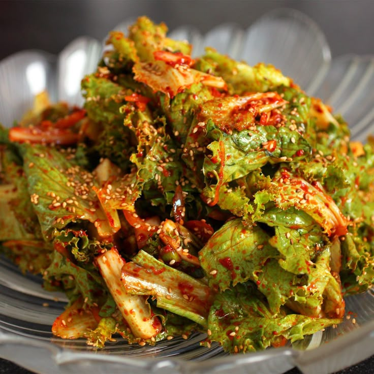 a salad in a plastic bowl with sesame seeds