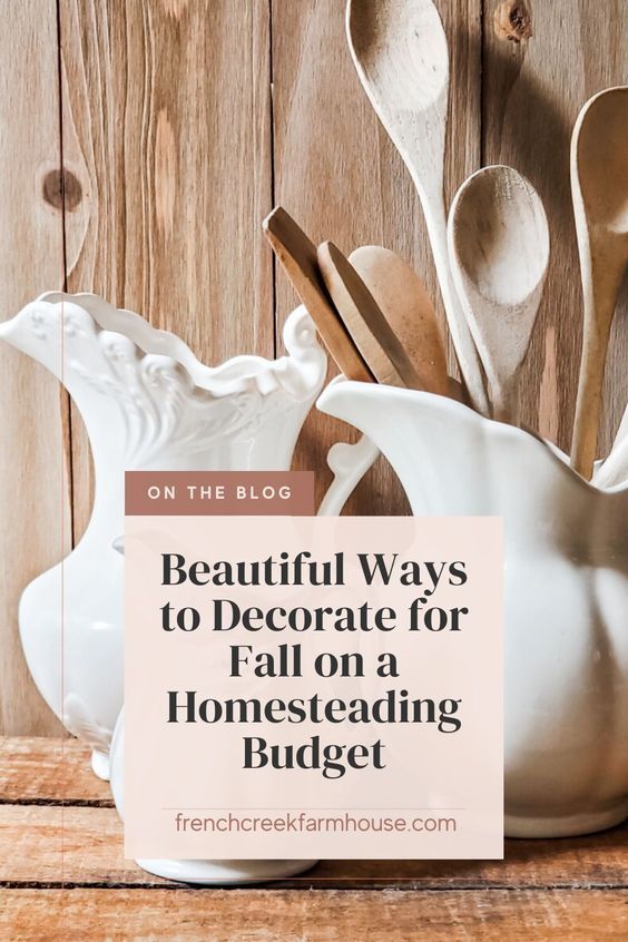 a white pitcher filled with spoons on top of a wooden table next to a sign that says beautiful ways to decorate for fall on a homeseading budget