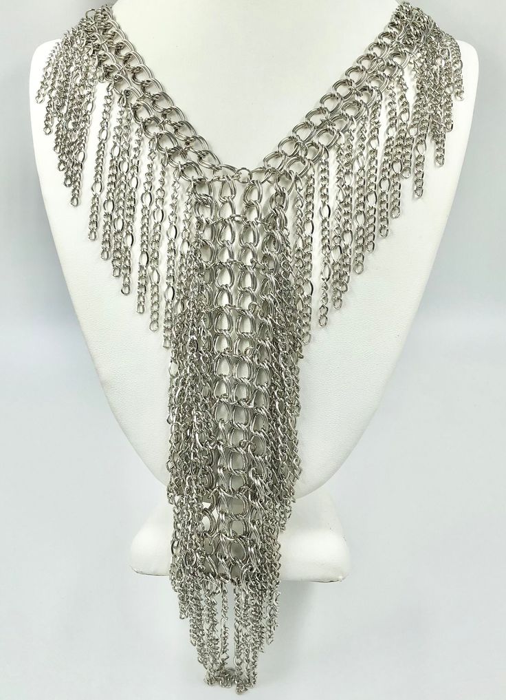 Chain mail necklace. Multi strand. Drop dangle V, jump ring chain necklace. Unisex. NOS Never worn. Mixed style of steel chain.  Neck opening length 20 inches. Total length of the drop is 36 inches. To continue shopping in my store, click the link below: https://www.etsy.com/shop/MagicOfLee Metal Dangle Chain Necklace Costume Jewelry, V Jump, V Necklace, Chainmail Necklace, Ring Chain, Mix Style, Chain Mail, Chain Ring, Multi Strand