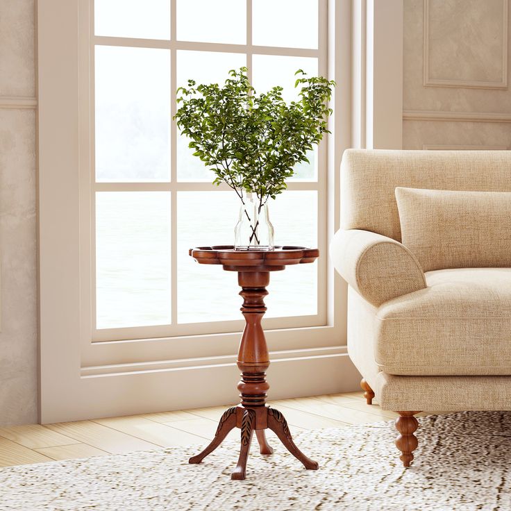 a living room scene with focus on the sofa and table in front of the window