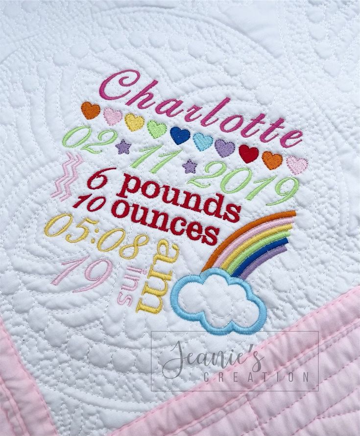 a quilted wall hanging with the words charlotte and rainbows on it