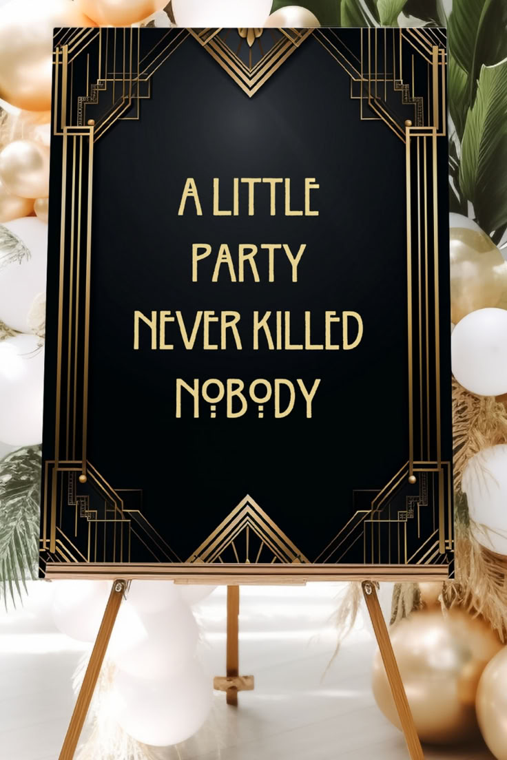 a little party never killed nobody sign in front of balloons and garlands with greenery