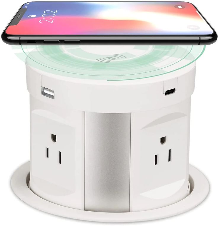 an iphone is sitting on top of a charging station