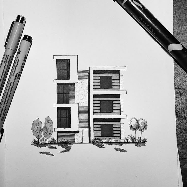 a drawing of a building with trees and bushes next to it, on top of a piece of paper