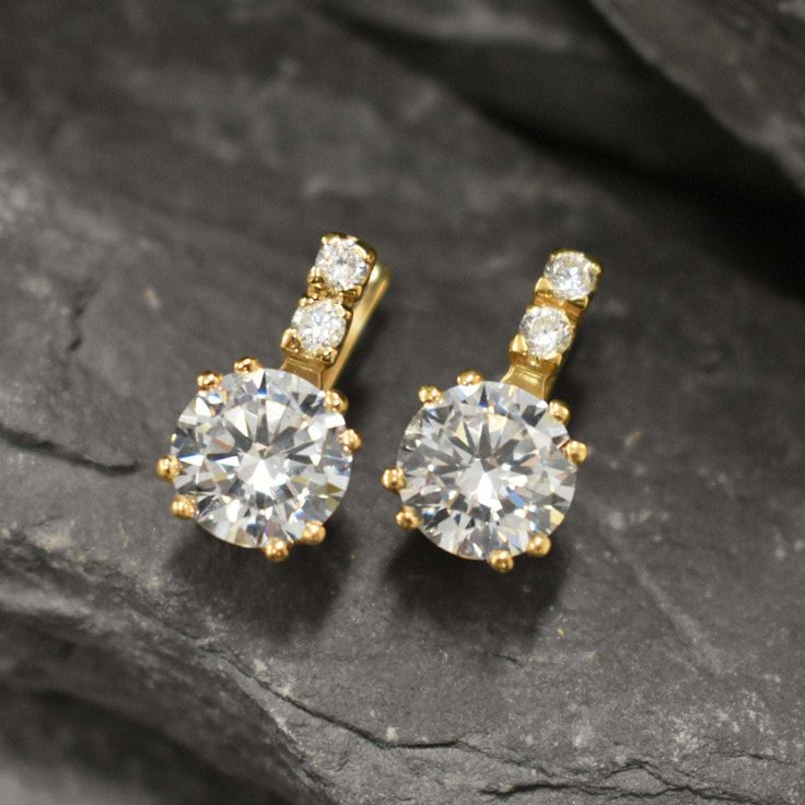 Gold CZ Diamond Earrings set with Created CZ Diamonds in a flawless clarity & color at 10mm (4 Ct a pair).Gold Vermeil: 18k Gold over Solid 925 Sterling Silver ☞ made to last.Click here for ☞ Matching RingMatching Pendant ☞ please ask meDetails:• Created CZ Diamonds in a flawless clarity• CZ Diamond: 10mm each, 4 Ct a pair, diamond cut• Lever Back Closure - "English Lock"• Dimensions: Length 20mm, Width 10mm• 18k Gold VermeilSKU 2073 Elegant Yellow Gold Crystal Earrings For Anniversary, Classic Gold Cubic Zirconia Earrings, Fine Jewelry Bridal Earrings With Brilliant Cut Cubic Zirconia, Classic Gold Crystal Earrings With Cubic Zirconia, Cubic Zirconia Brilliant Cut Diamond Drop Earrings, Gold Moissanite Earrings For Anniversary, Gold Moissanite Anniversary Earrings, Classic Gold Plated Diamond Earrings, Gold Moissanite Diamond Earrings For Formal Occasions