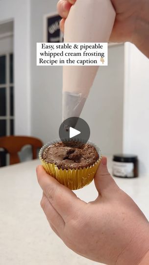 a person is holding a cupcake with a knife stuck in it and the caption says, lady, table & prope