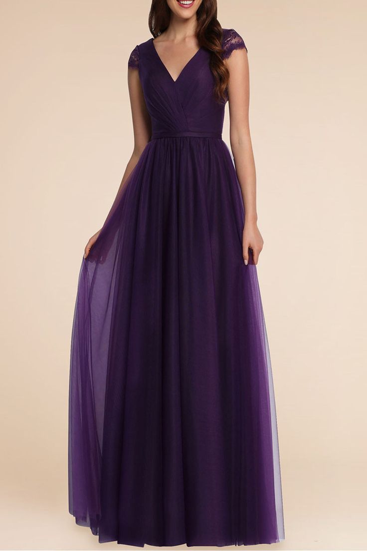 a bridesmaid in a long purple dress