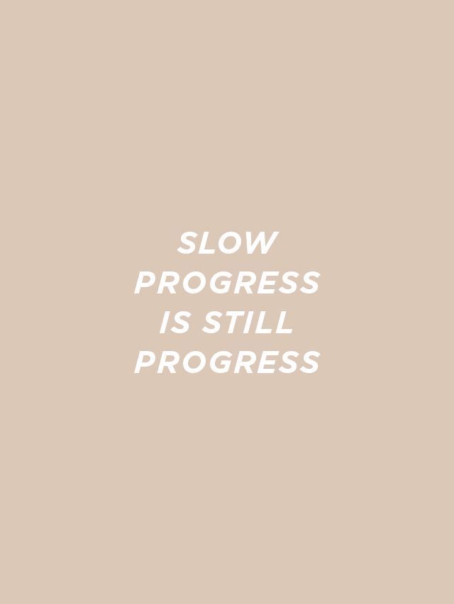 the words slow progress is still progress written in white on a beige background with an orange and