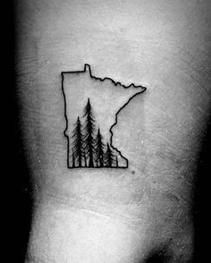 a black and white photo of a tattoo with trees in the shape of a state