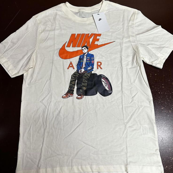 Nike Sportswear Air Moto Anime Tee T Shirt Sz Mdium Fd1332-110 Nwt $35 Casual Pre-shrunk Athletic Fit T-shirt, White Graphic Print T-shirt For Light Sports, Urban Short Sleeve T-shirt For Sports Events, Urban Style Short Sleeve T-shirt For Sports Events, White Breathable T-shirt With Relaxed Fit, White Breathable Relaxed Fit T-shirt, Nike Athletic Fit T-shirt, Nike Graphic Print T-shirt For Sports Season, Nike Graphic Print T-shirt For Sporting Events