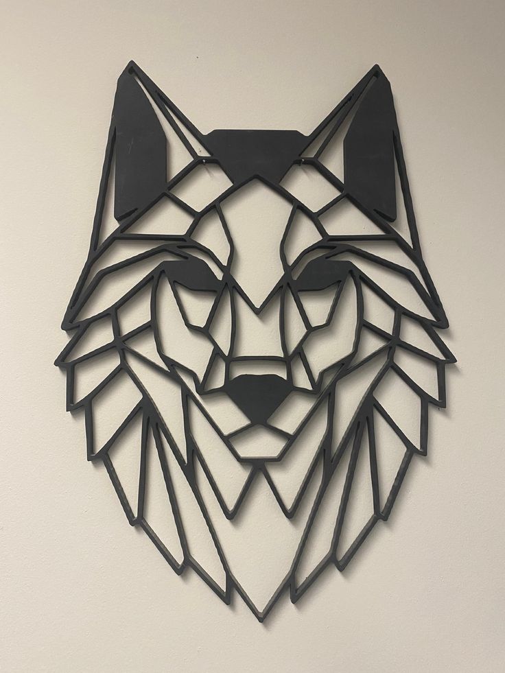 a metal cut out of a wolf's head