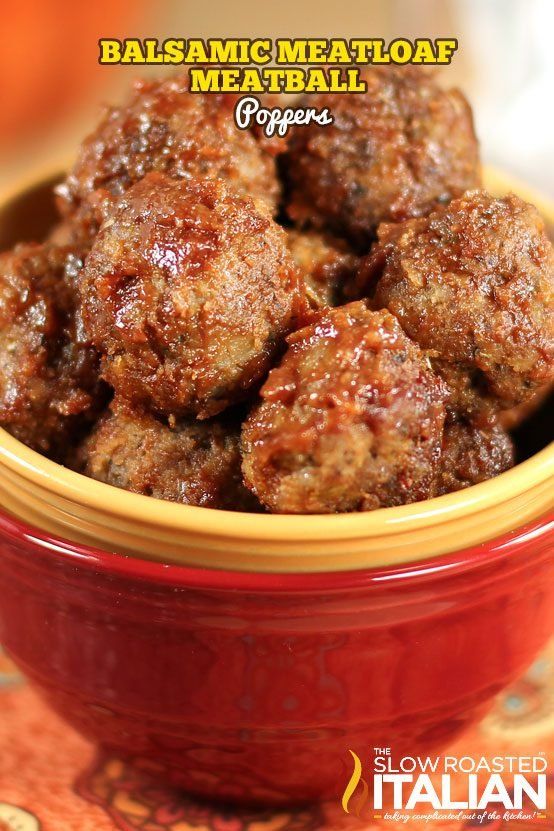 some meatballs in a red bowl on a table