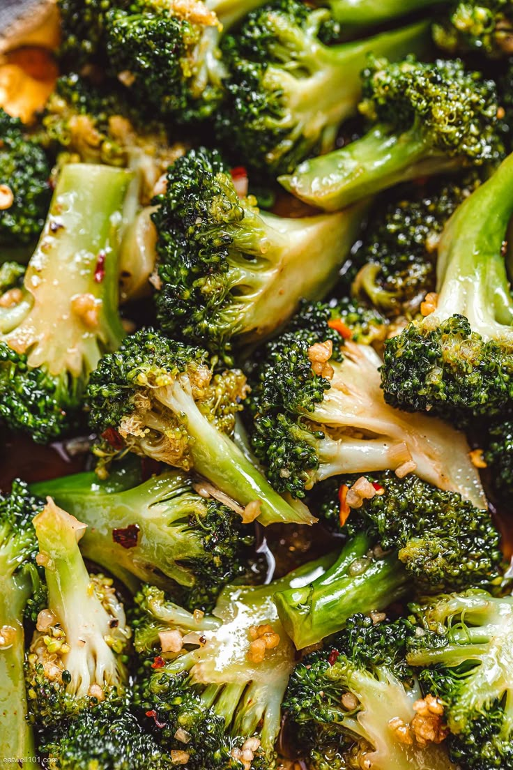 cooked broccoli florets with sesame seeds and seasoning