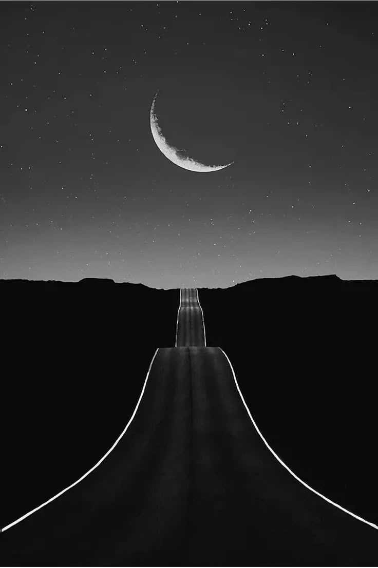 an empty road with the moon in the sky above it and stars on the horizon