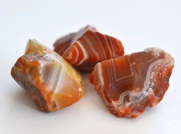 three pieces of agate stone sitting next to each other