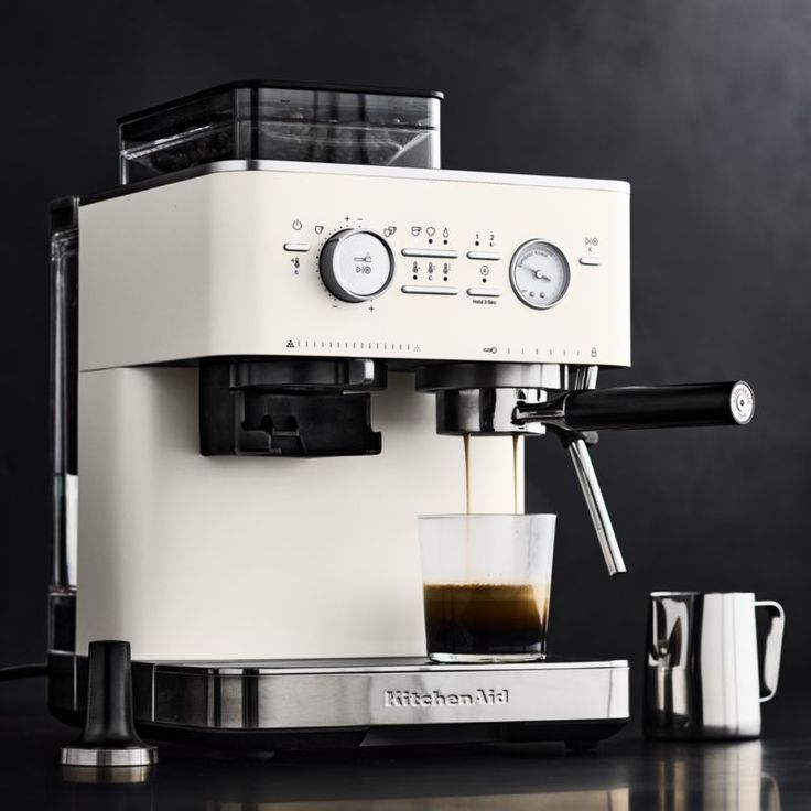 an espresso machine sitting on top of a table