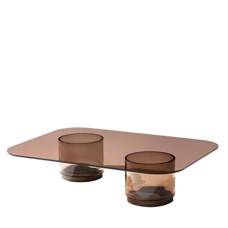 a glass table with two vases on the top and one is brown in color