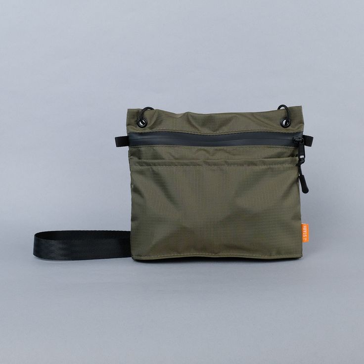 A minimalist’s dream bag. The Wayland Sacoche sits tight to the body but holds a lot for its size. Two reach-in pockets on either side will hold small items for quick-release. An inside sleeve (with a 70/30 split) will keep your pens and your phone separate from the rest, and safe from the click-click-click noise of a Dream Bag, Travel Crossbody, Crossbody Bags For Travel, Ripstop Fabric, Fall Accessories, Best Bags, Dog Accessories, Quick Release, Corporate Gifts