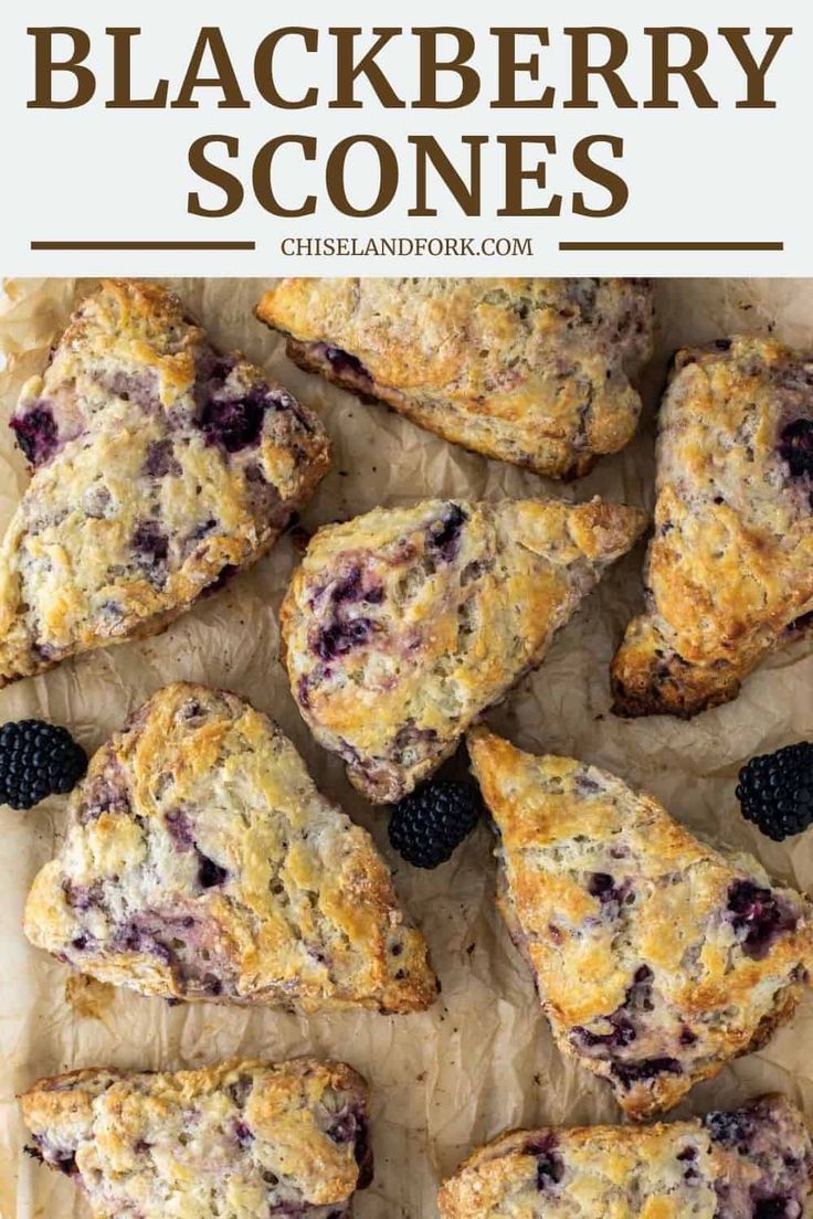 blueberry scones on parchment paper with blackberries in the middle and text overlay