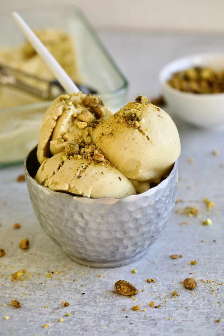 two bowls filled with ice cream and nuts