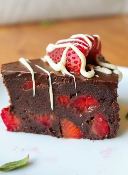 a piece of chocolate cake with strawberries on top