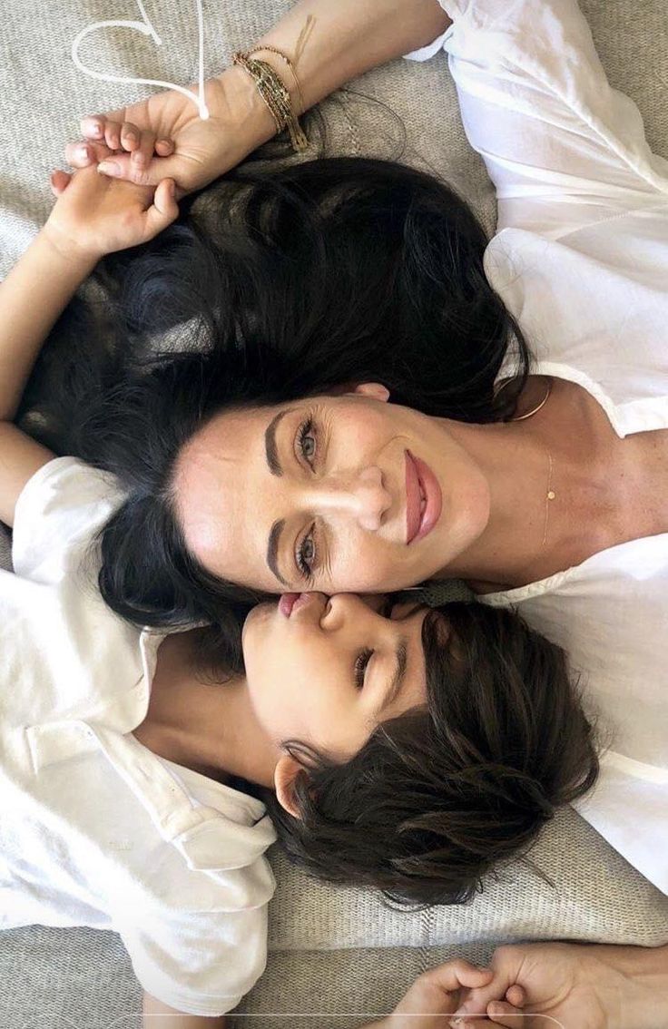 two women laying on top of each other