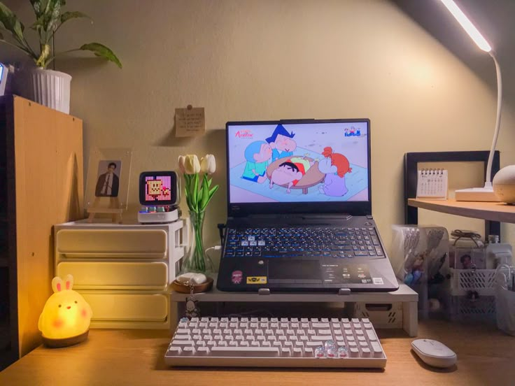 an open laptop computer sitting on top of a wooden desk next to a mouse and keyboard