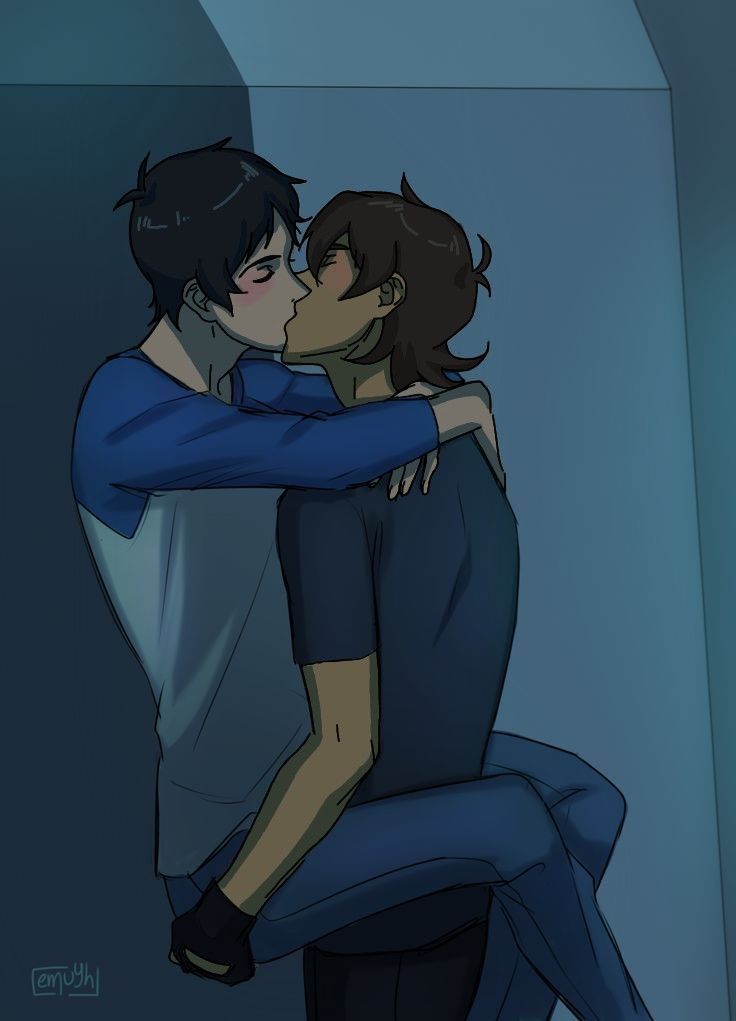 two people hugging each other in the middle of a room with blue walls and floor