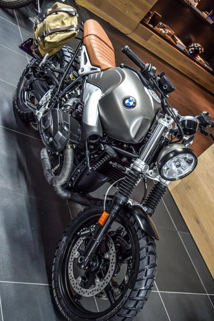 a bmw motorcycle parked in a showroom