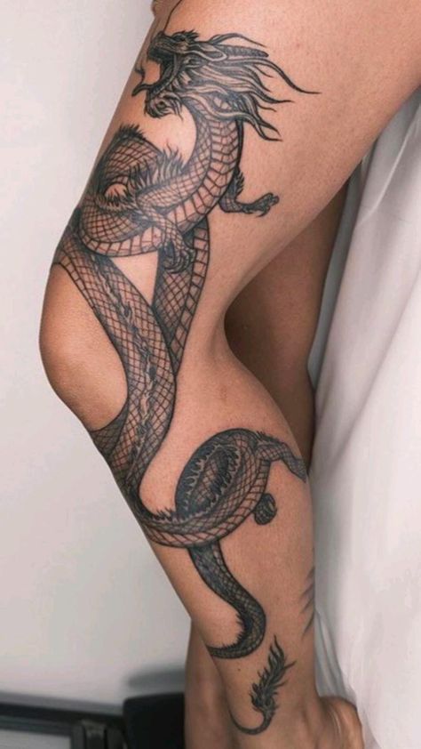 a woman's legs with tattoos on them and a dragon tattoo on the leg