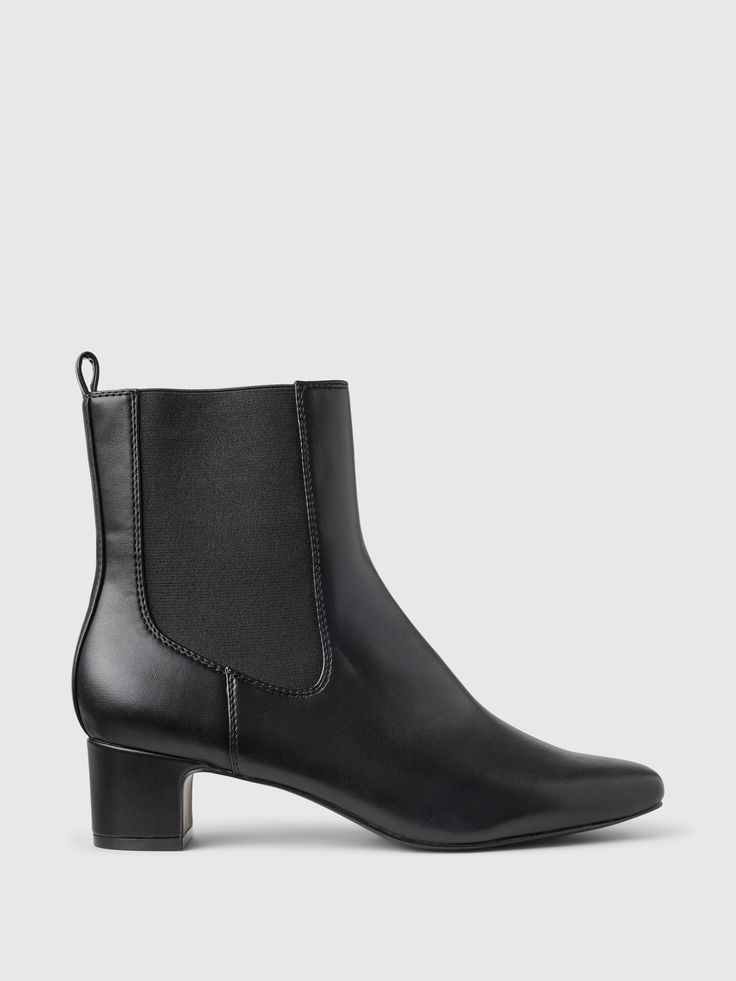 These ankle boots are made with a smooth vegan leather upper.  Elasticized sides.  Pointed toe.  Heel height: 2" 5 cm. ) For more fit and sizing info, check out our Size Guide. Best Black, Black Booties, Black Ankle Boots, Leather Ankle Boots, Low Heels, Vegan Leather, Size Guide, Leather Upper, Heel Height