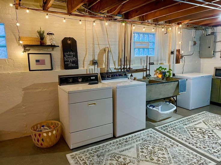 a kitchen with white appliances and rugs on the floor