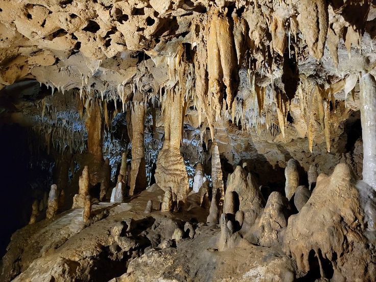 the inside of a cave with stalate formations