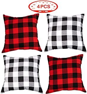 four red and black buffalo plaid pillows sitting next to each other on a white background