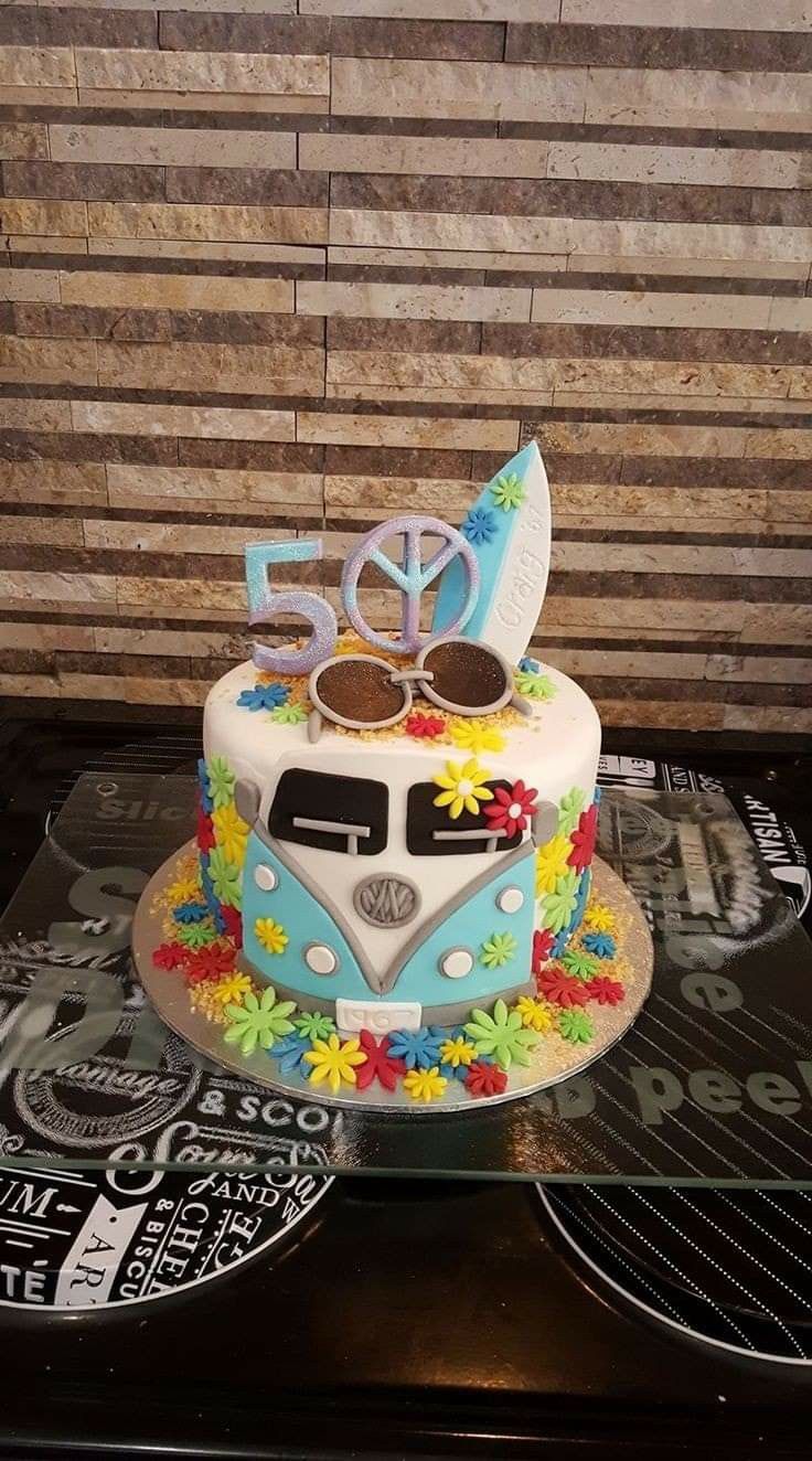 a cake decorated with flowers and the number 50