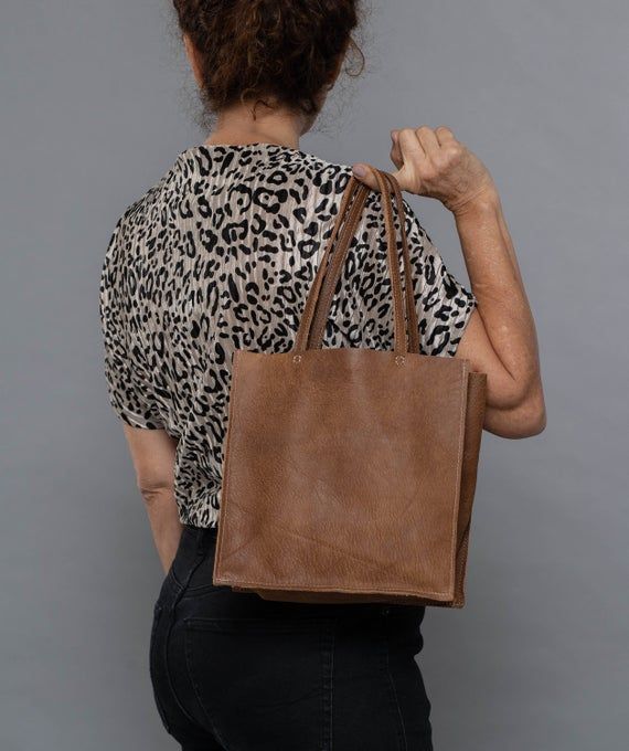 Check out other colors of this bag style here:https://www.etsy.com/shop/bags1and1stuff?ref=hdr_shop_menu&section_id=15504059A small leather tote to use when going out, this is what makes this bag worth purchasing for your own use. This simple leather tote is made out of leather and is sure to suit the outfit you'll be wearing for the party or any special occasion you'll be attending. Though it is small in size, this small black bag is sure to maximize your look as it is able to give the best Everyday Use Paper Shoulder Bag, Square Shoulder Bag For Everyday Use, Square Soft Leather Box Bag For Daily Use, Everyday Use Tote Box Bag, Brown Rectangular Box Bag For On-the-go, Rectangular Soft Leather Shoulder Bag For Daily Use, Square Soft Leather Hobo Bag For Everyday, Brown Rectangular Bag For On-the-go, Brown Double Handle Box Bag For Everyday Use