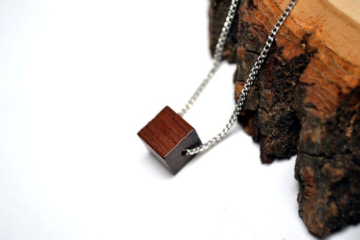 "Minimalist Cube Wood Pendant- Unique Wood bead Necklace - Choose your chain style and length  Cube Pendant measures 10mmX10mmX10mm LENGTH - You can select your desired length from the options drop-down choices or message me for a custom length. (If you do not leave me a note, I will send you a 28\" chain ) :) - Lengths 26\" and shorter will close with a clasp. Above 26\" have no clasp CHAIN STYLE -Select your desired style of chain from the option drop-down choices Or Convo me. QUALITY Affordable Jewelry doesnt need to look cheap! I take care in choosing my materials and only craft things I would want to wear myself. I carefully selected the chains. They are very study and durable. D E L I V E R Y / G I F T All items are made to order. I usually make the item the same day you order and ge Minimalist Silver Chain Necklace With Square Pendant, Minimalist Brown Necklace For Everyday, Minimalist Brown Jewelry As A Gift, Minimalist Brown Jewelry As Gift, Minimalist Brown Jewelry For Gift, Minimalist Brown Sterling Silver Jewelry, Minimalist Brown Rectangular Jewelry, Brown Chain Necklace For Gift, Minimalist Brown Necklace For Gift