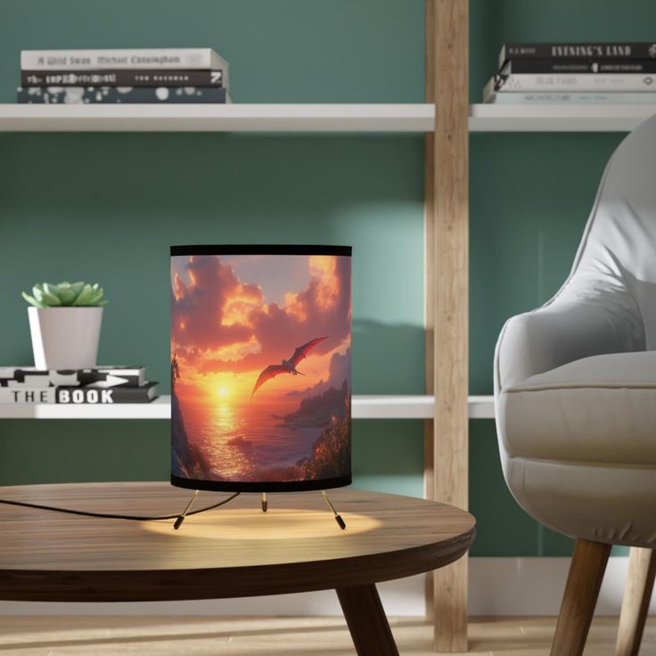 a table with a lamp on it next to a chair and bookshelf in the background