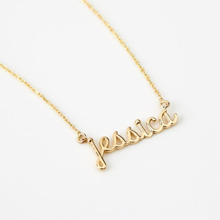 Script Name 14K Gold Necklace Adorn yourself with this 14K Gold Script Name Necklace, a perfect blend of personalization and style. Customizable for women, it's more than just a piece of jewelry; it's a statement of identity. This dainty 14k yellow gold necklace, makes an excellent personalized gift, elevating your elegance and charm. With its timeless design, it's a valuable addition to your jewelry collection, enhancing your style and personality. You'll have: 14k solid gold handcrafted neckla 14k Gold Name Necklace With Initial Pendant, Customizable 14k Gold Initial Pendant Jewelry, Elegant 14k Gold Initial Pendant Custom Necklace, Formal Yellow Gold Name Necklace With Initial Pendant, Elegant 14k Gold Custom Initial Pendant Necklace, Dainty 14k Gold Personalized Gift Necklace, Elegant Custom 14k Gold Initial Pendant Necklace, Dainty 14k Gold Necklace For Personalized Gift, 14k Gold Filled Yellow Gold Necklace For Personalized Gift