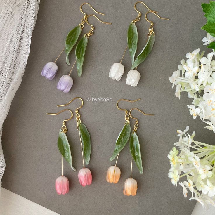 3D Tulip flower dangle earrings, Handmade shrink plastic tulip drop earrings, Pink Orange White purple tulips, Unique gift for her 🤍 Hypoallergenic 🌸 Handmade with love ✨ Cute & Dainty  🎁 Gift ready 〰️Click👇🏻 Find more Earrings🎀  https://www.etsy.com/shop/byYeeSo ◽️ PACKAGING ◽️  * The jewelry will be nicely packaged * Comes with a drawstring suede pouch * If you need personalized gift note, please click the link below, add it to your cart when check out to upgrade your packaging. https://www.etsy.com/listing/1008661207/upgrade-gift-packaging?ref=shop_home_active_1&frs=1 ◽️ SHIPPING ◽️ * USPS First Class Shipping Service with tracking number * All products will be shipped from USA ◽️ CARE INSTRUCTIONS ◽️ * Avoid perfumes or sprays * Avoid getting your jewelry wet * Wipe down the jewe Handmade Earrings Prices, Cheap Handmade Flower Shaped Jewelry, Cheap Flower Decorated Jewelry As Gift, Cheap Handmade Teardrop Flower Earrings, Cheap Teardrop Flower Earrings As Gift, Affordable Plastic Jewelry For Spring, Cheap Vintage Flower Earrings, Cheap Handmade Flower-shaped Jewelry, Cheap Flower Charm Drop Earrings