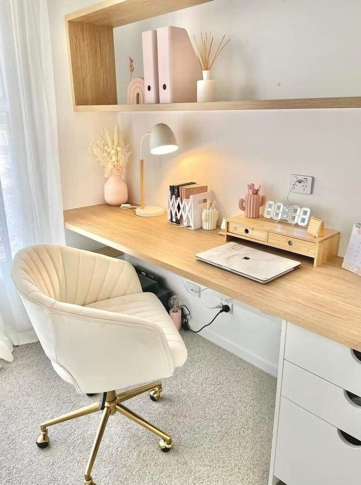 a white chair sitting in front of a wooden desk