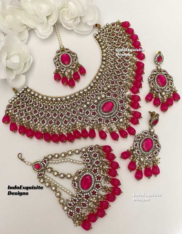 Premium Quality Pakistani bridal set/Pakistani Jewelry/ Indian and Pakistani wedding jewelry/ Bollywood jewelry/ kundan and Polki jewelry/Reception jewelry  This elegant necklace set comes with earrings, tikka and Jhoomer/Passa/ hot pink magenta color  All items are shipped from Brampton, Ontario, Canada. If you need your item by a certain day, please reach out to us for express delivery option before placing the order. We kindly request to consider minor variations in colors, shades, textures as pictures displayed may slightly vary from the actual product due to digital image limitations.Please expect the possibility of some minor imperfections when buying handmade jewelry. Please contact us for any questions you might have. Thank you and Happy shopping 😊 Pink Tilla Jewelry Sets For Wedding, Pink Chandbali Tikka For Wedding, Pink Bollywood Jewelry Sets For Wedding, Pink Stone Work Tikka For Wedding, Bollywood Style Pink Bridal Sets For Wedding, Pink Hand Set Bridal Sets For Reception, Pink Kundan Tikka For Wedding, Pink Meenakari Jewelry Sets For Wedding, Pink Stone Work Jewelry Sets For Wedding